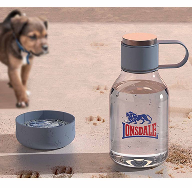 50 Oz. Asobu Dog Bowl Lite Bottle shown next to a dog.