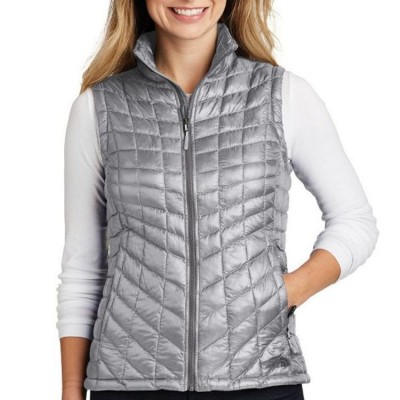 The North Face Women's ThermoBall Trekker Vest shown on a model in Mid Grey
