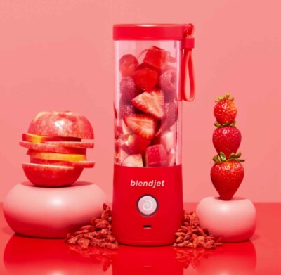 BlendJet 2 Portable Blender shown with strawberries and an apple
