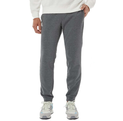 Adidas Unisex Fleece Joggers shown in Dark Grey Heather on a male model
