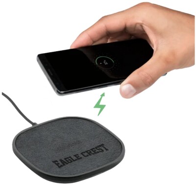 Mophie Charging Pad shown with hand and phone with an example logo on it