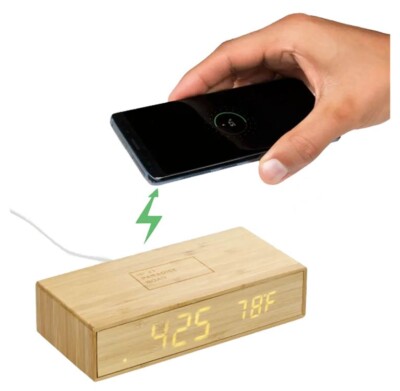 Bamboo Charging Desk Clock shown with a phone that can be charged on it